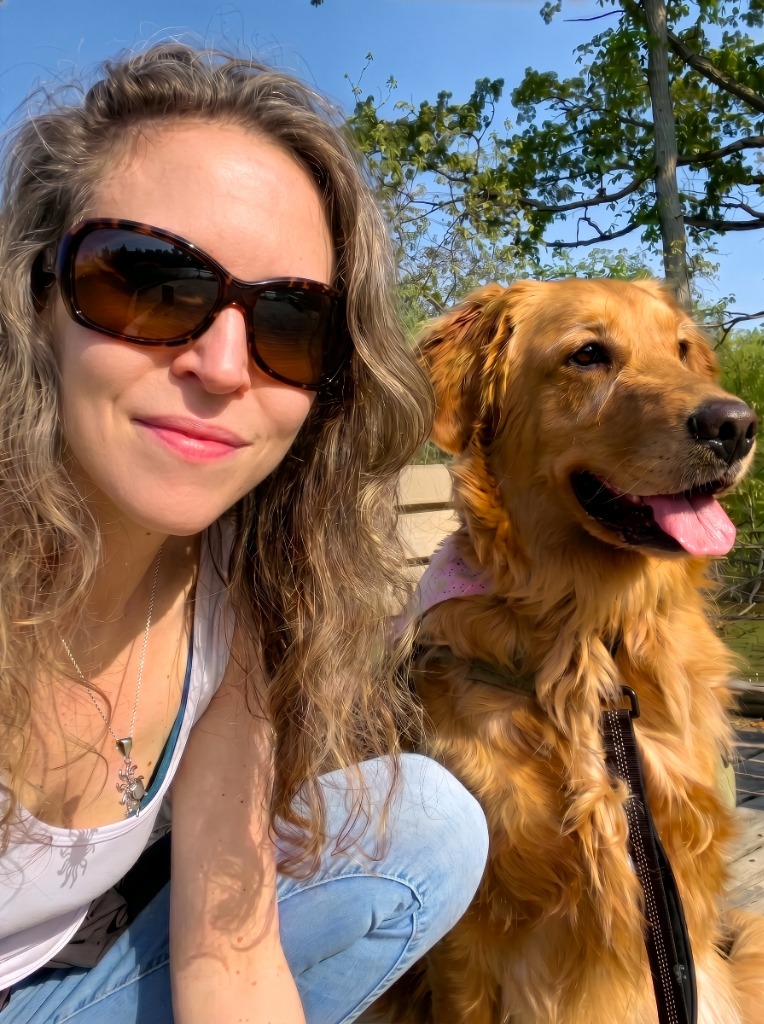 Yerma Woods with her golden retriever Mosey Juniper